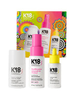 Simple K18 Australia repair, protect, and smooth holiday kit with bottles of hair treatment products in sleek packaging.